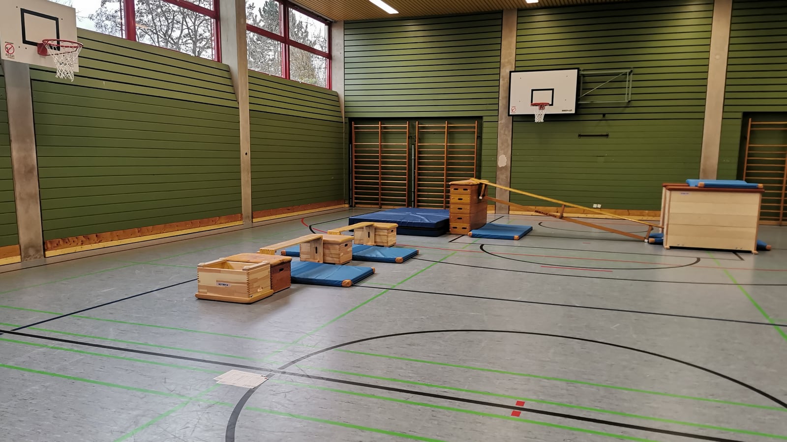 A sports hall set up with equipment for small children